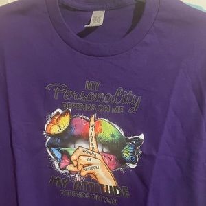 A purple medium woman’s t shirt with a personality\attitude saying.